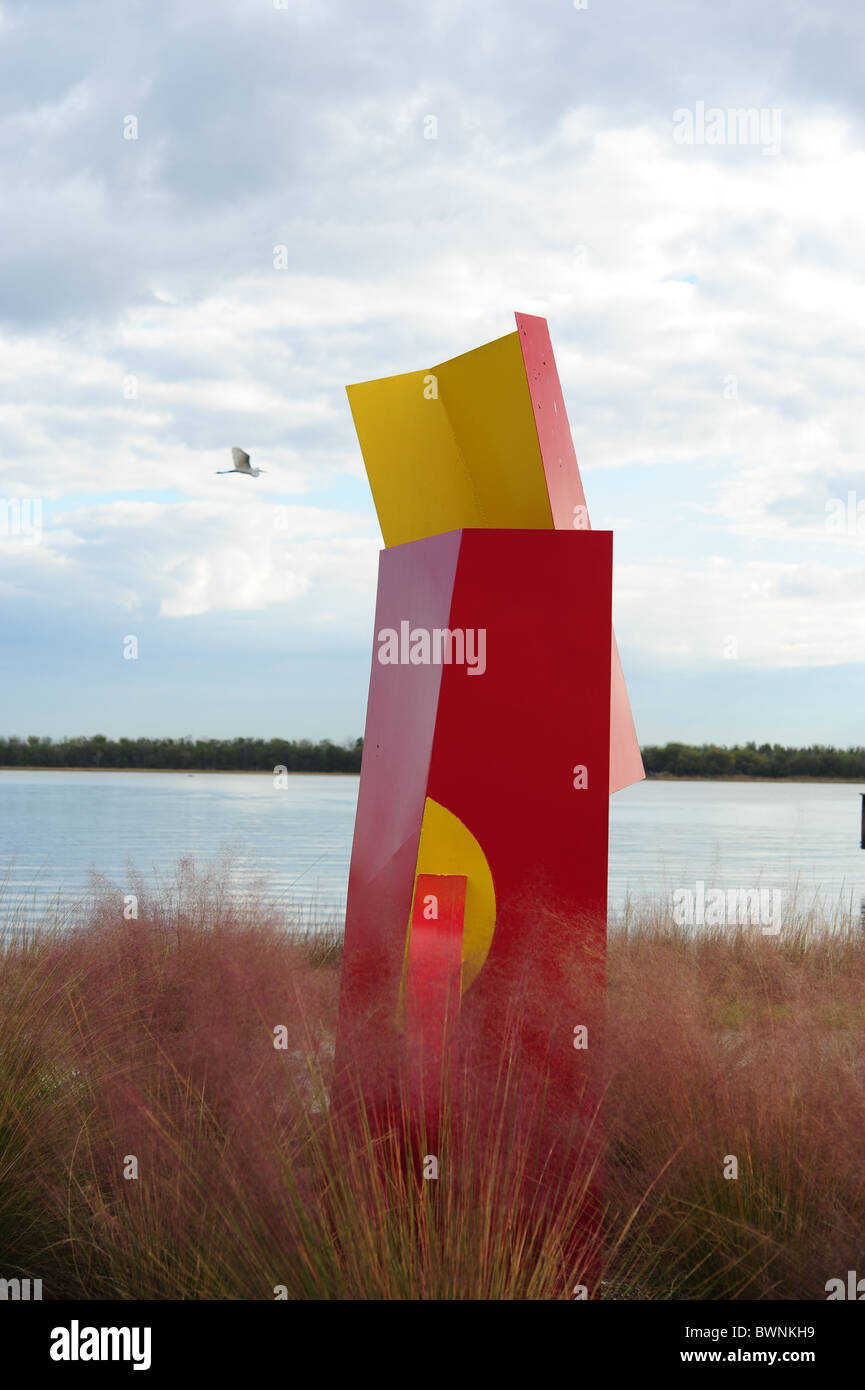 Situational vertical yellow and red art object on Cooper river Stock Photo