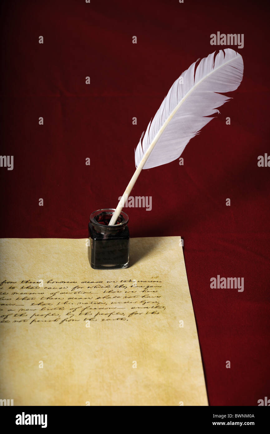 Quill, pen and handwritten text on parchment paper - Text is end of Abraham Lincoln's Gettysburg Address Stock Photo