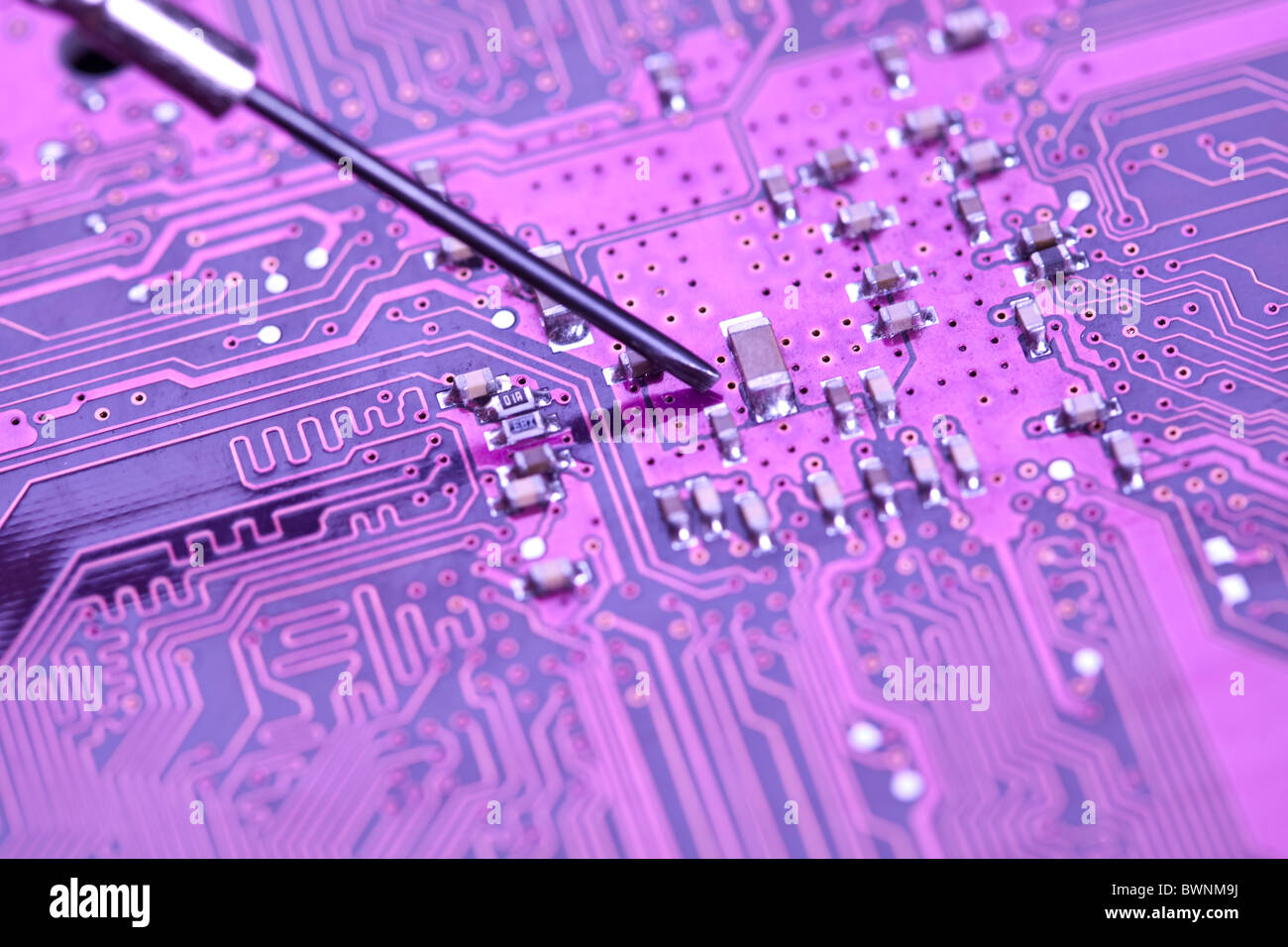 A close up shot of the backside of a computer circuit board Stock Photo