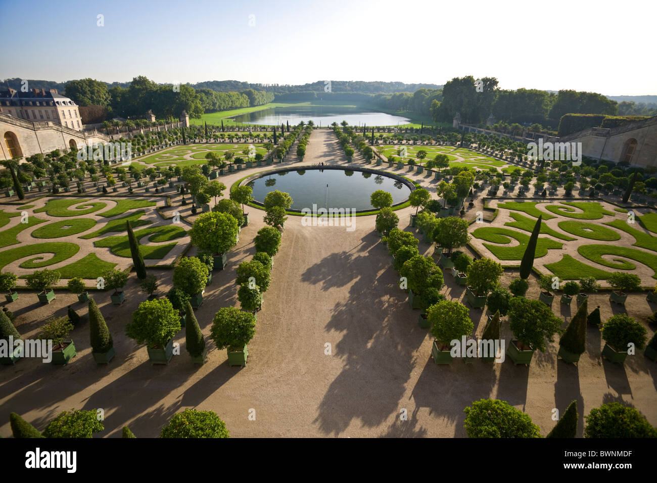 The Orangerie and the Pièce d' Eau des Suisses of the Palace of Versailles (France).  L'Orangerie et la Pièce d'eau des Suisses Stock Photo