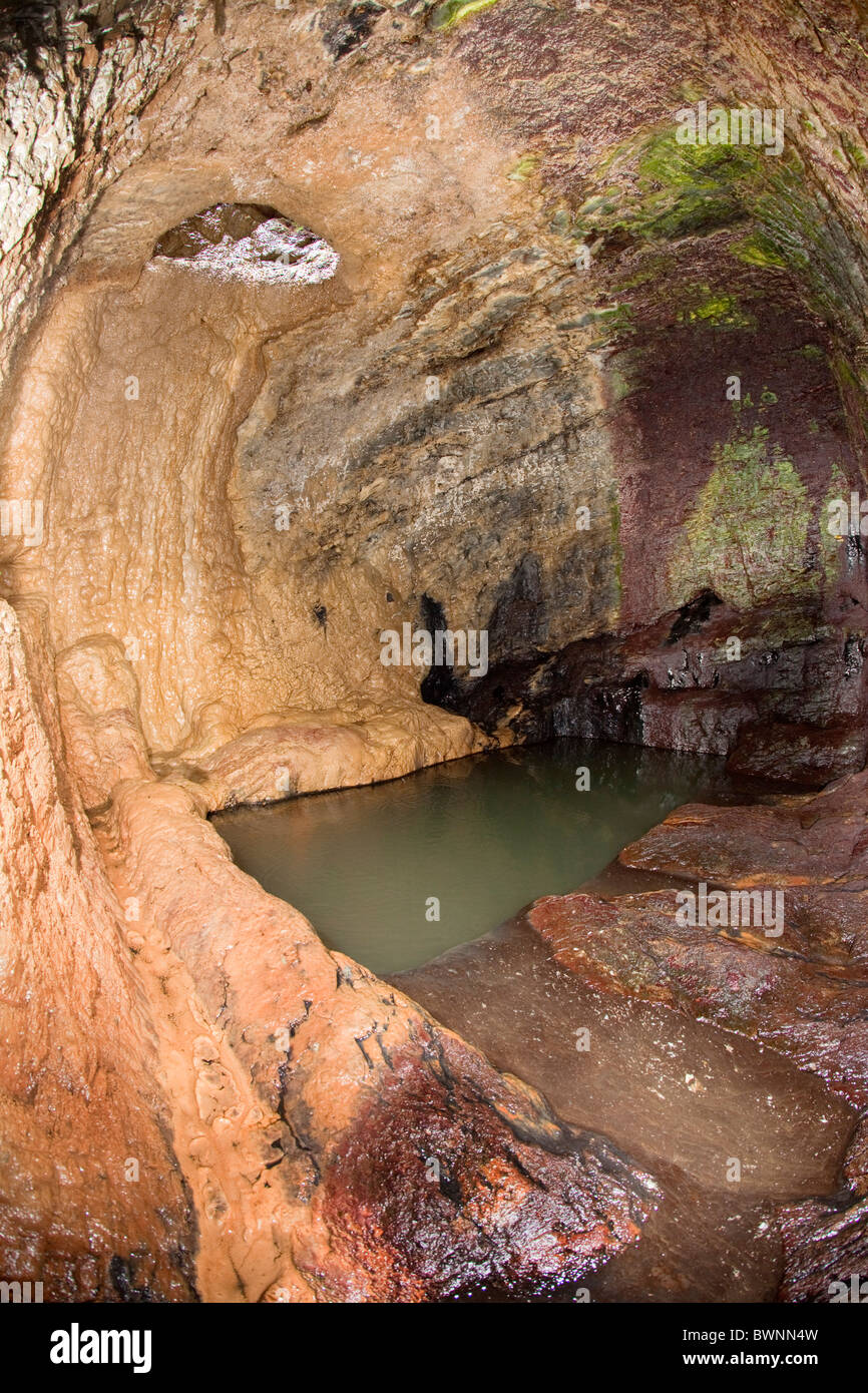Stackhouse Cave; a bath cut into the cliff for the Acton family; Cornwall Stock Photo