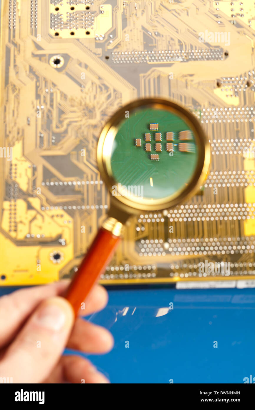 A close up shot of the backside of a computer circuit board, also known as a motherboard. Stock Photo