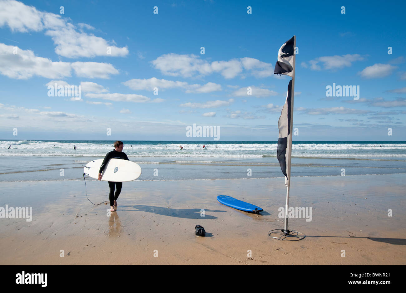 A Surfer in Fistral beach, Newquay, Cornwall, UK Stock Photo