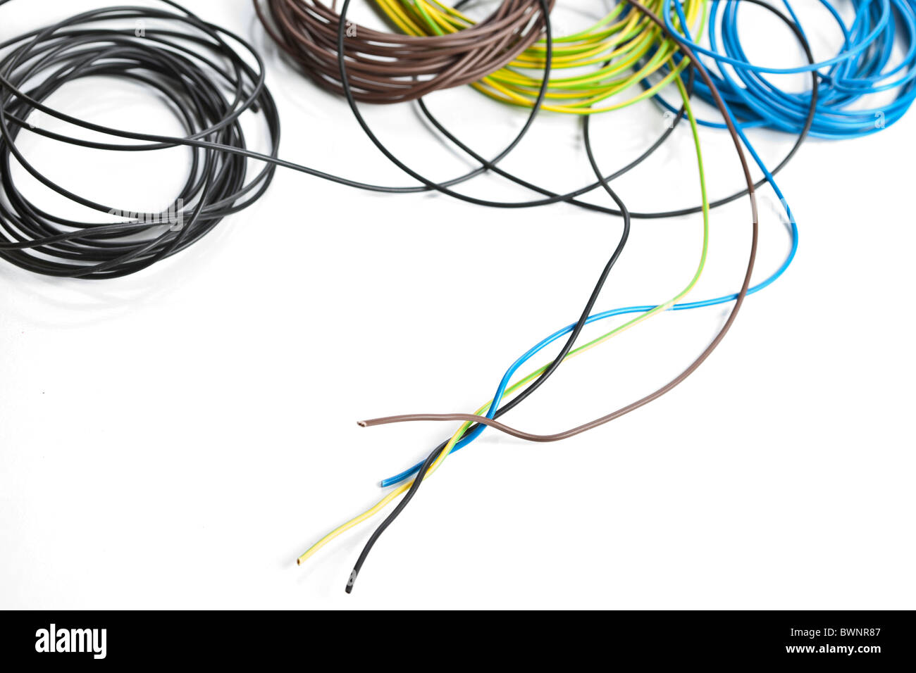 Colorful coils of cables on a white background Stock Photo