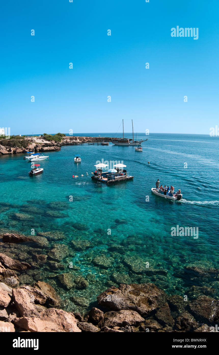 Bay for scuba diving in the Mediterranean sea with motor boats and a platform for diving. People go on a vessel Stock Photo