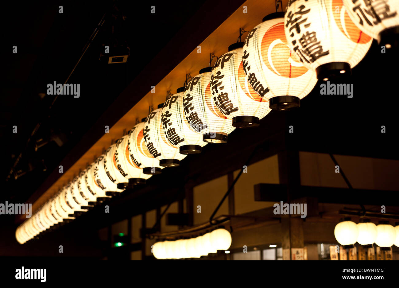 A row of Japanese lanterns typically found at Japanese festivals Stock Photo