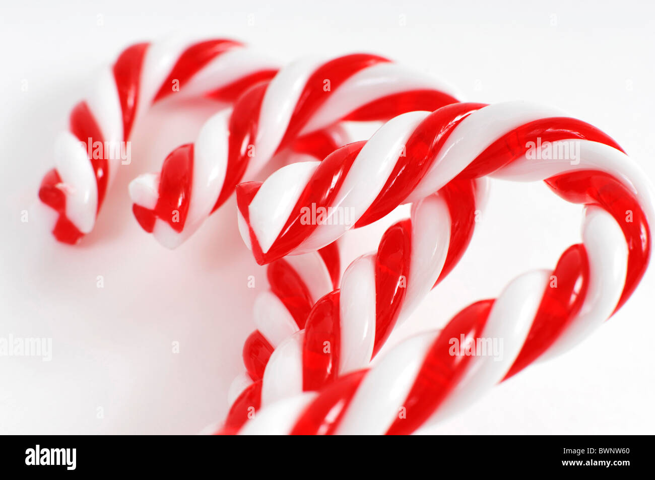 Christmas candy canes closeup Isolated on white background Stock Photo