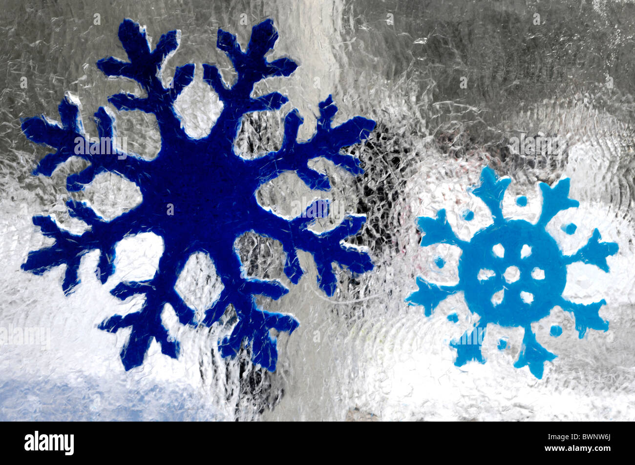 Snowflakes frozen in ice blocks Stock Photo