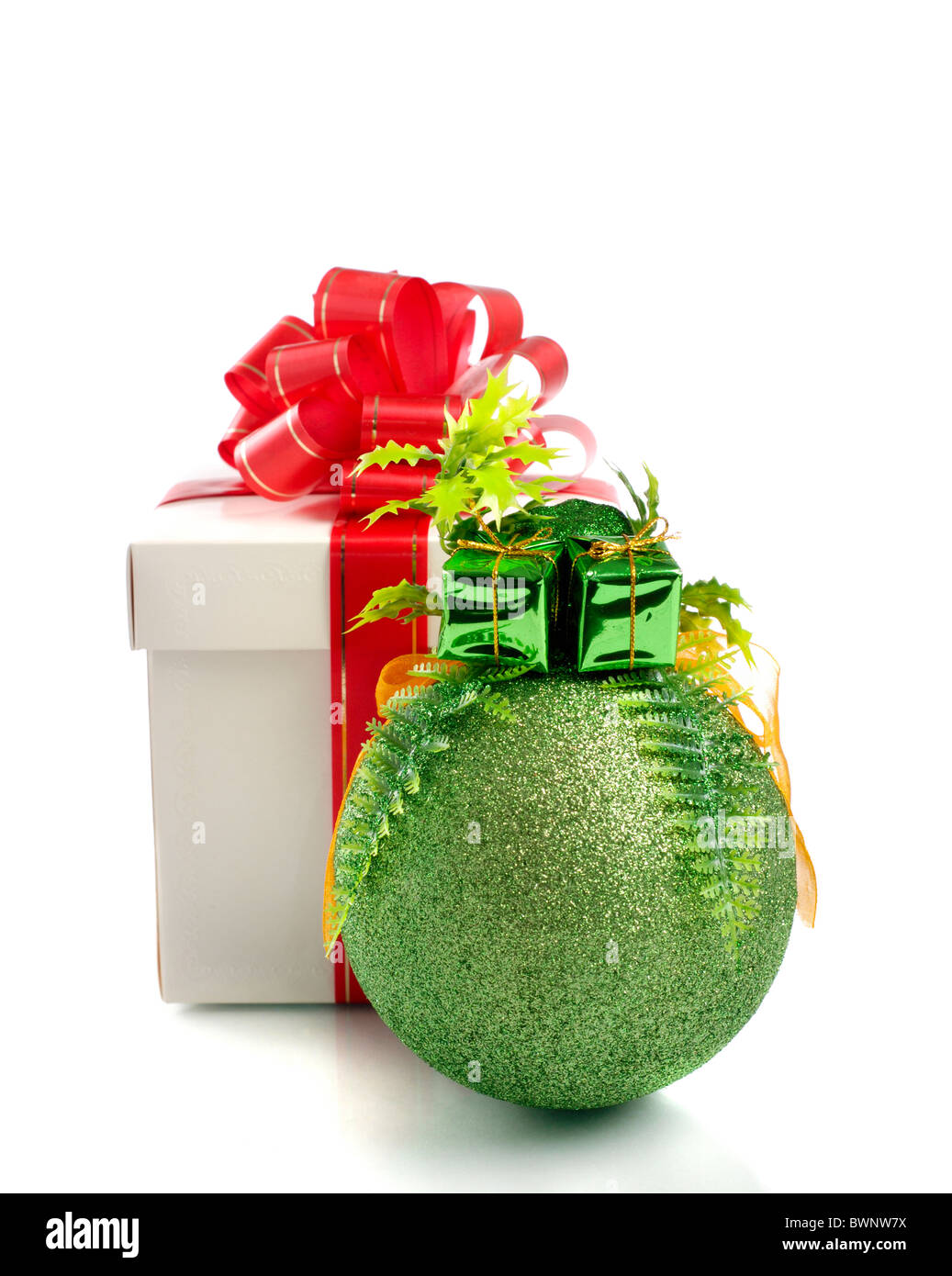 Gift box with a red bow and a Christmas bauble isolated on white ...