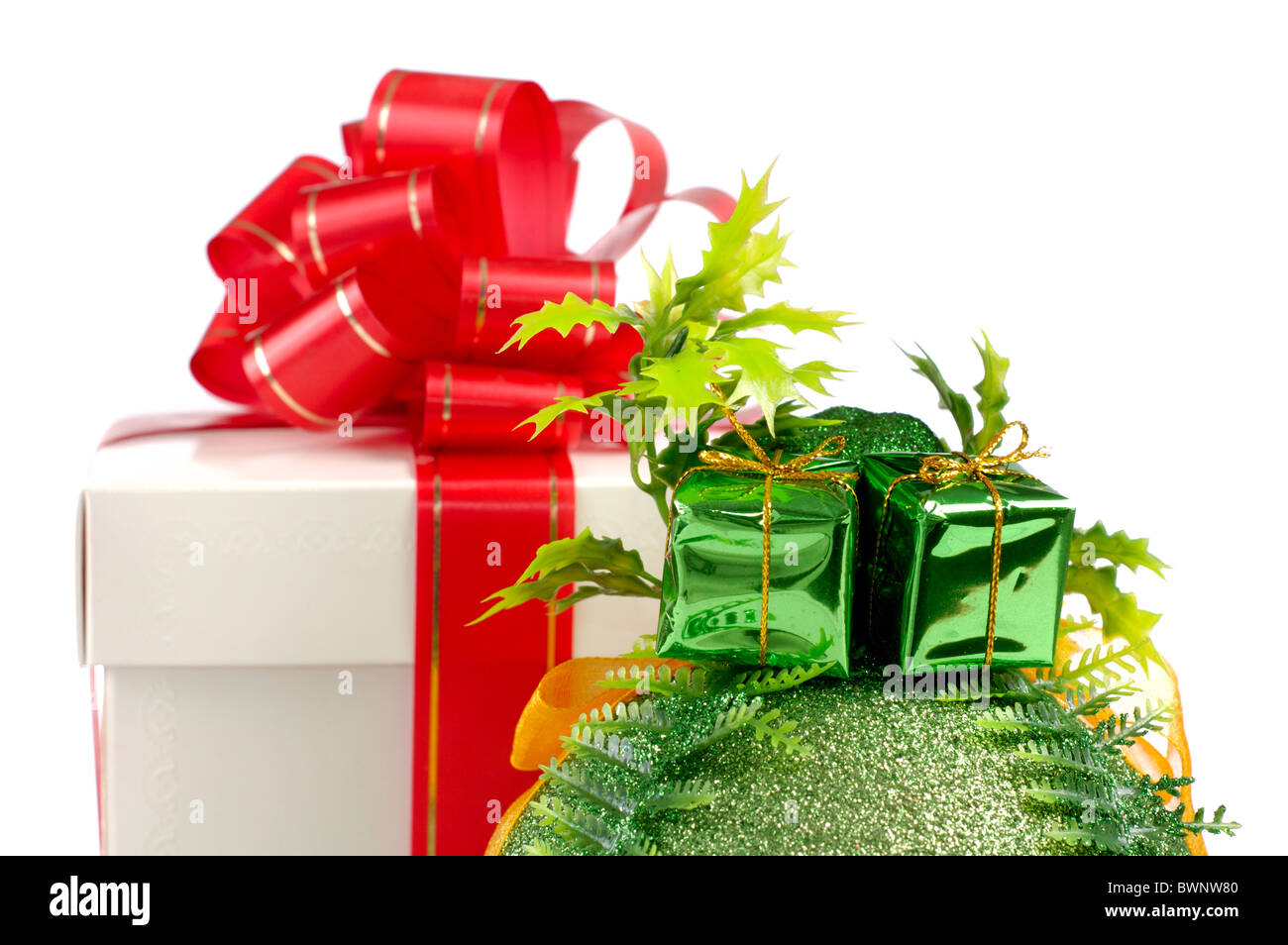 Gift box with a red bow and a Christmas bauble isolated on white ...