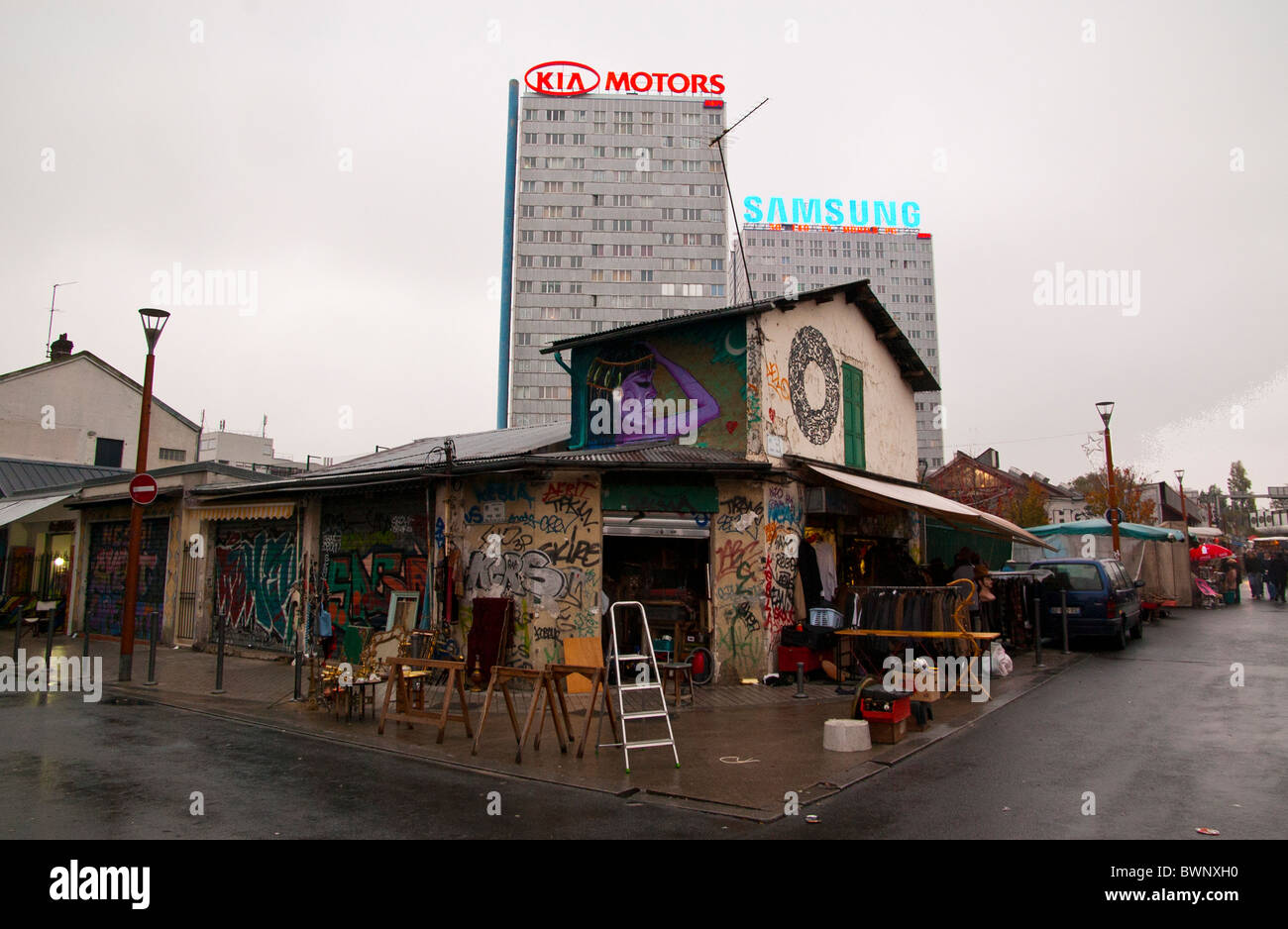 Flee market in Paris, France. KIA Motors and Samsung buildings in the background create an architectural contrast Stock Photo