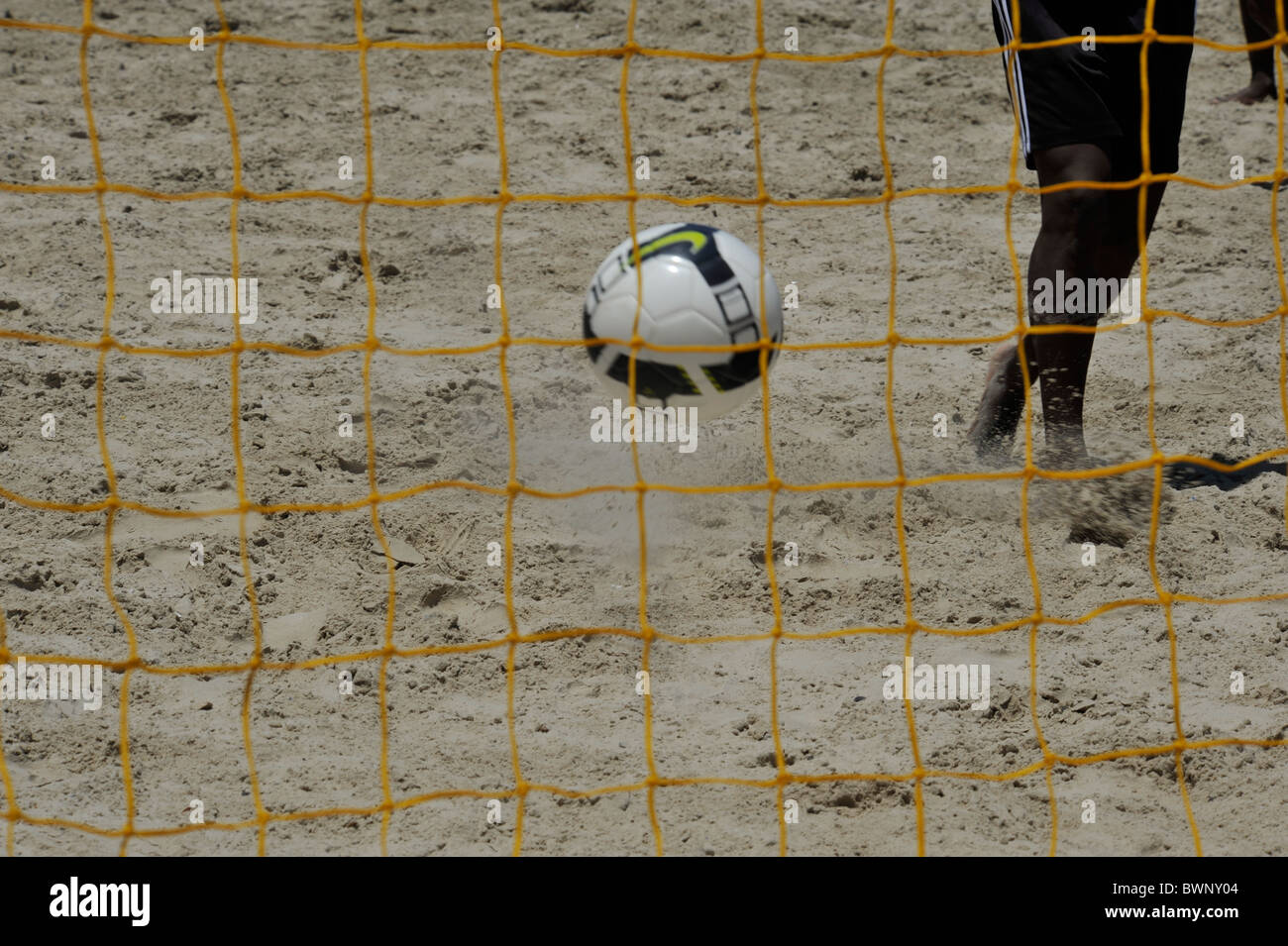 Cape Town, South Africa, soccer player scoring goal, football flying