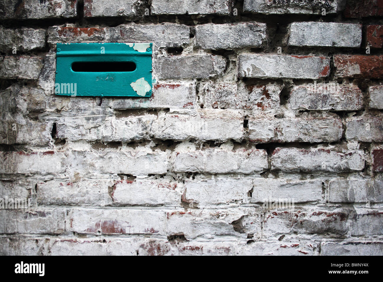 mail slot in white brick wall Stock Photo Alamy