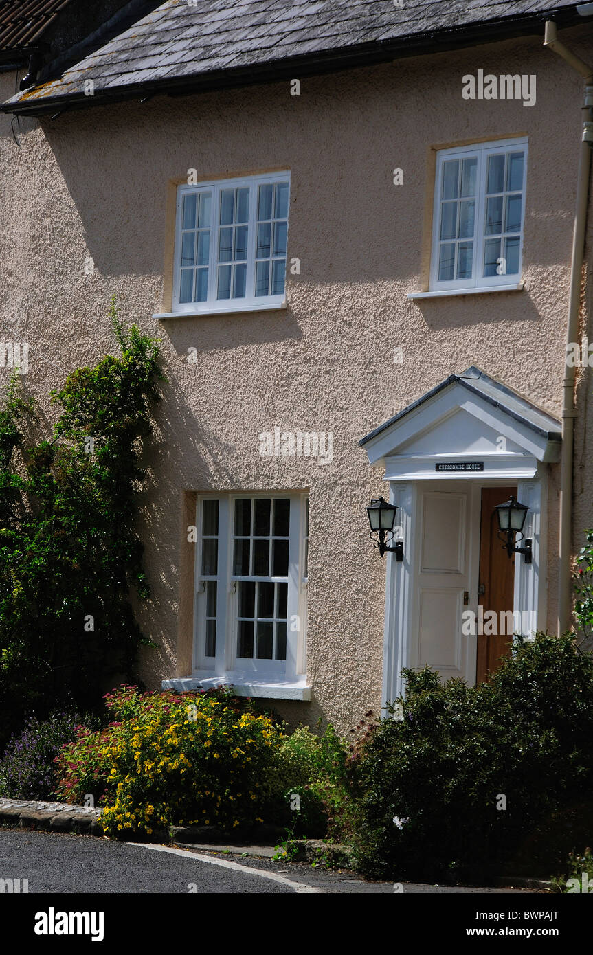 The front elevation of a pink pebble-dashed house in the village of Cerne Abbas, Dorset, UK July 2010 Stock Photo