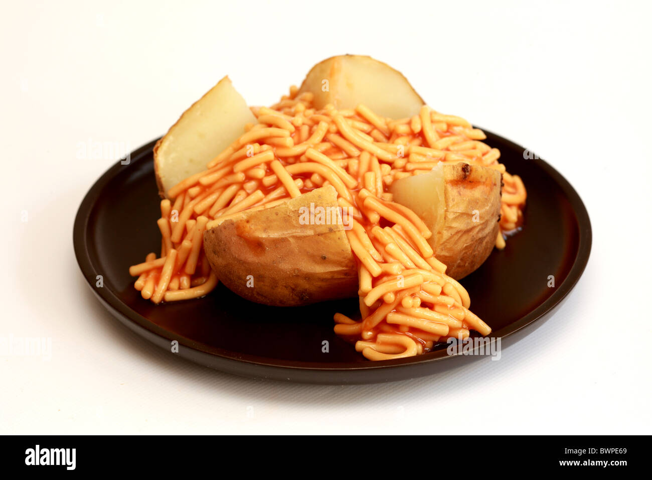 Jacket Potato with Spaghetti Stock Photo Alamy