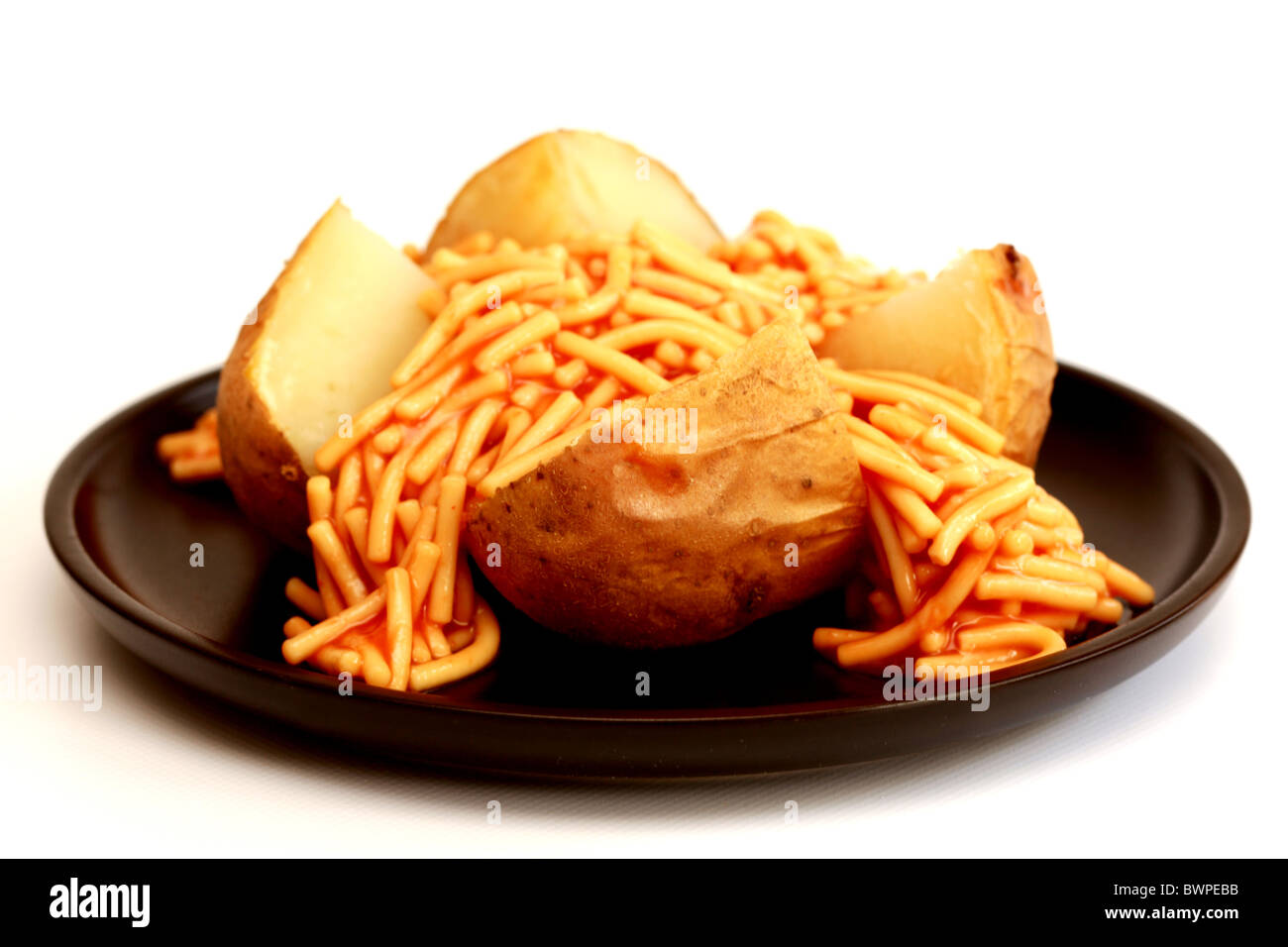 Jacket Potato with Spaghetti Stock Photo Alamy