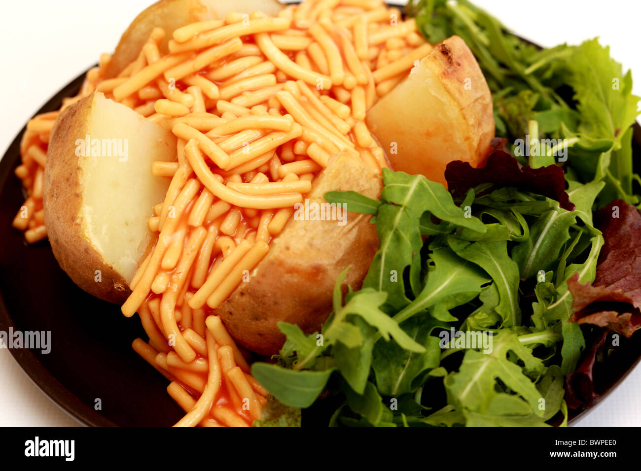 Jacket Potato with Spaghetti Stock Photo Alamy