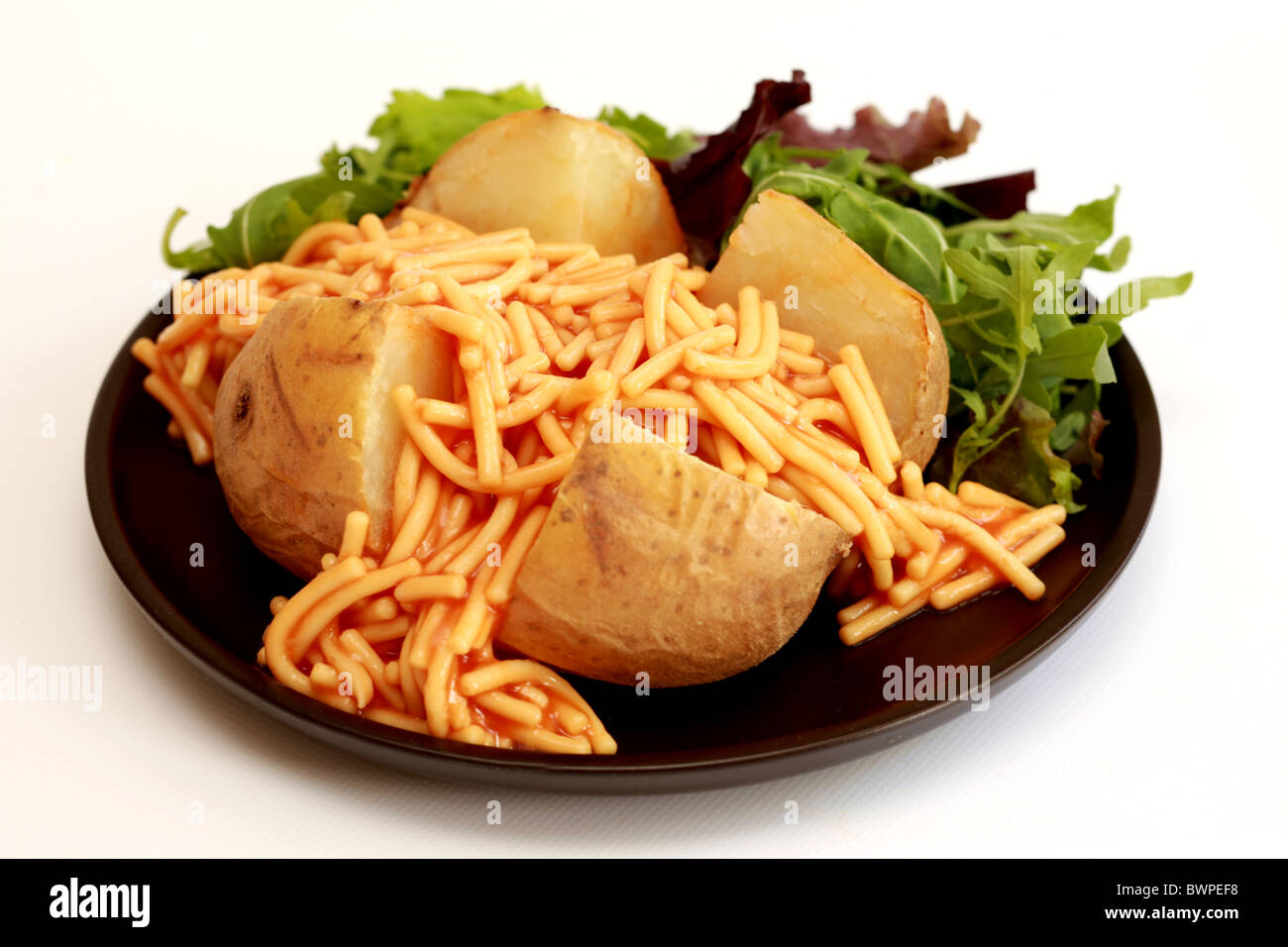 Jacket Potato with Spaghetti Stock Photo Alamy
