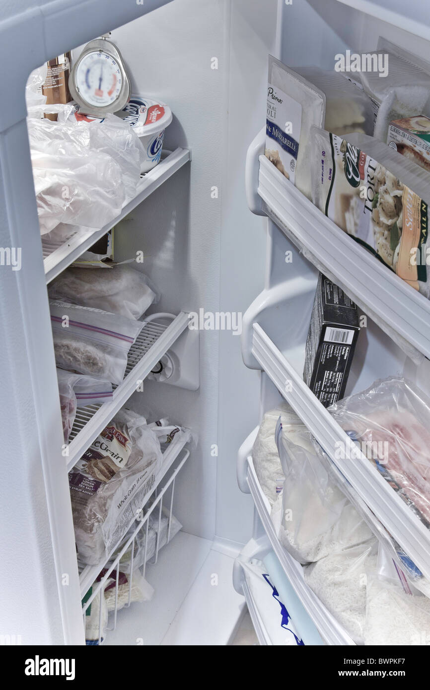Home Freezer Interior, Door Open, Filled with Food Stock Photo