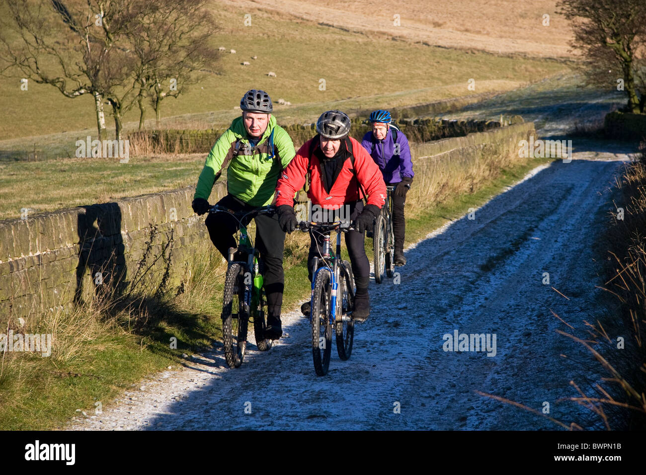 Mountain biking in winter, descending into Piethorne/Ogden Valley, Pennines ( near Milnrow, Greater Manchester, ) England, UK Stock Photo