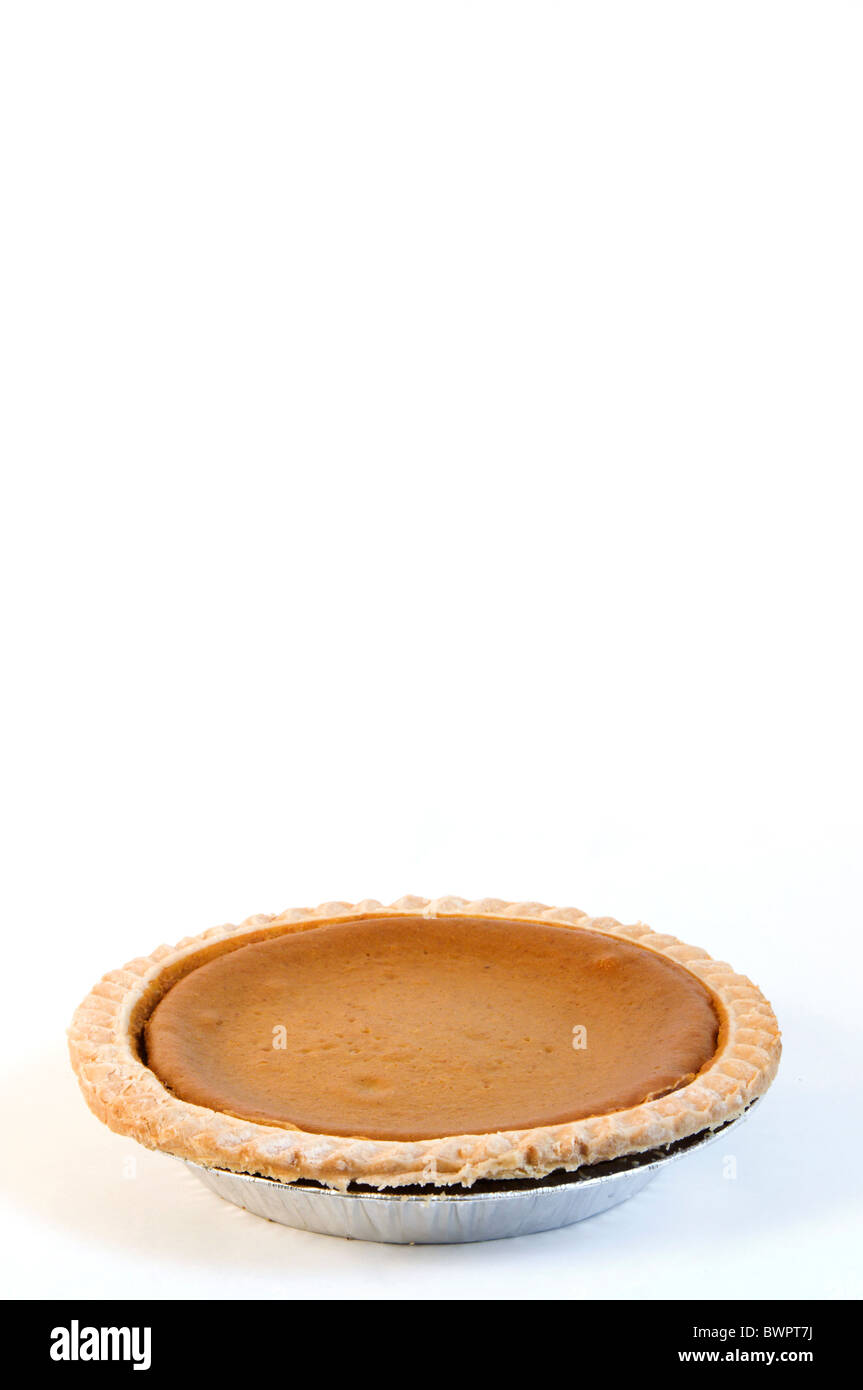 Store-bought pumpkin pie on white vertical background with room for text. Stock Photo