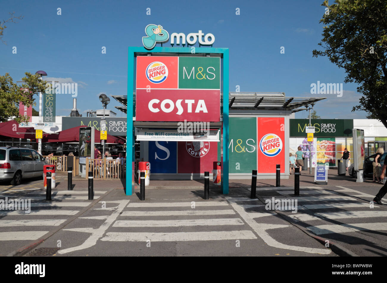 Entrance to the Moto Leigh Delaware M4 services advertising Burger King, M&S and Costa coffee outlets. Stock Photo
