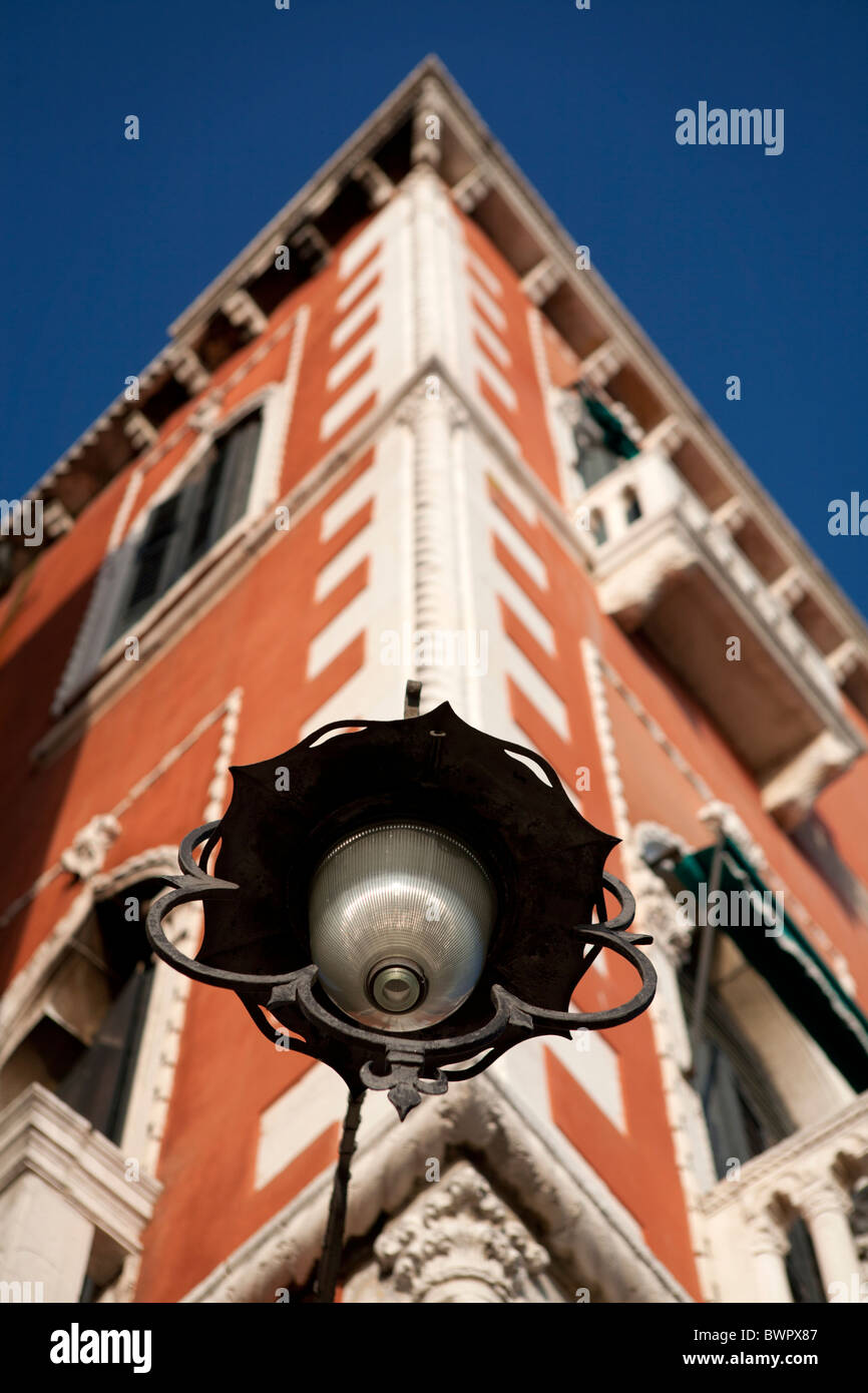 A vintage streetlight on the corner of a house in Venice, Italy. Stock Photo