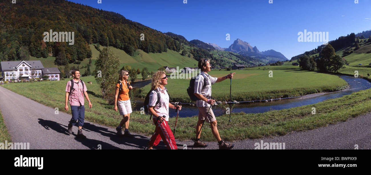 Switzerland Europe Toggenburg Alt St.Johann Canton St.Gallen hikers hiker group four persons hiking mountain Stock Photo