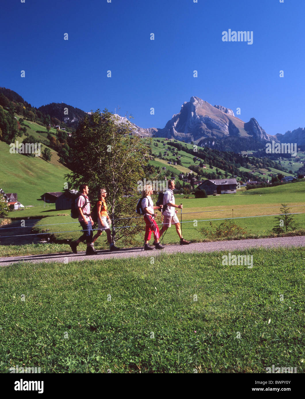 Switzerland Europe Alt St.Johann Canton St.Gallen Toggenburg river Thur hikers hiker hiking four persons gro Stock Photo