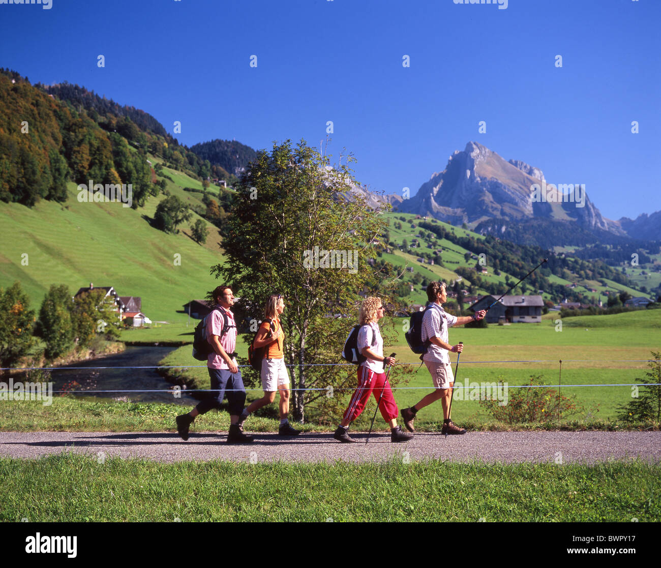 Switzerland Europe Alt St.Johann Canton St.Gallen Toggenburg river Thur hikers hiker hiking four persons gro Stock Photo