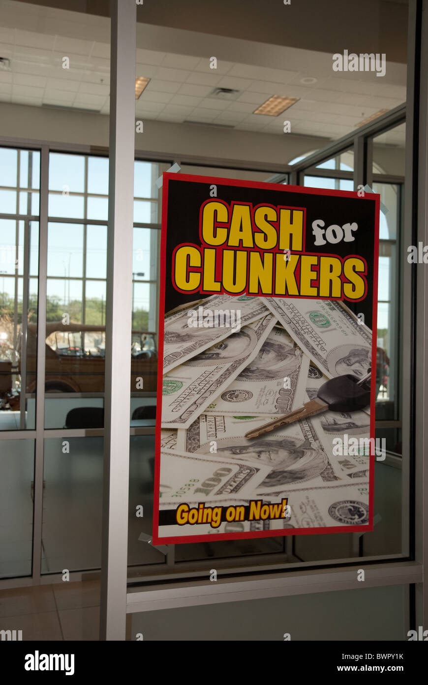 "Cash for Clunkers" sign on window of sales office at car dealership ...