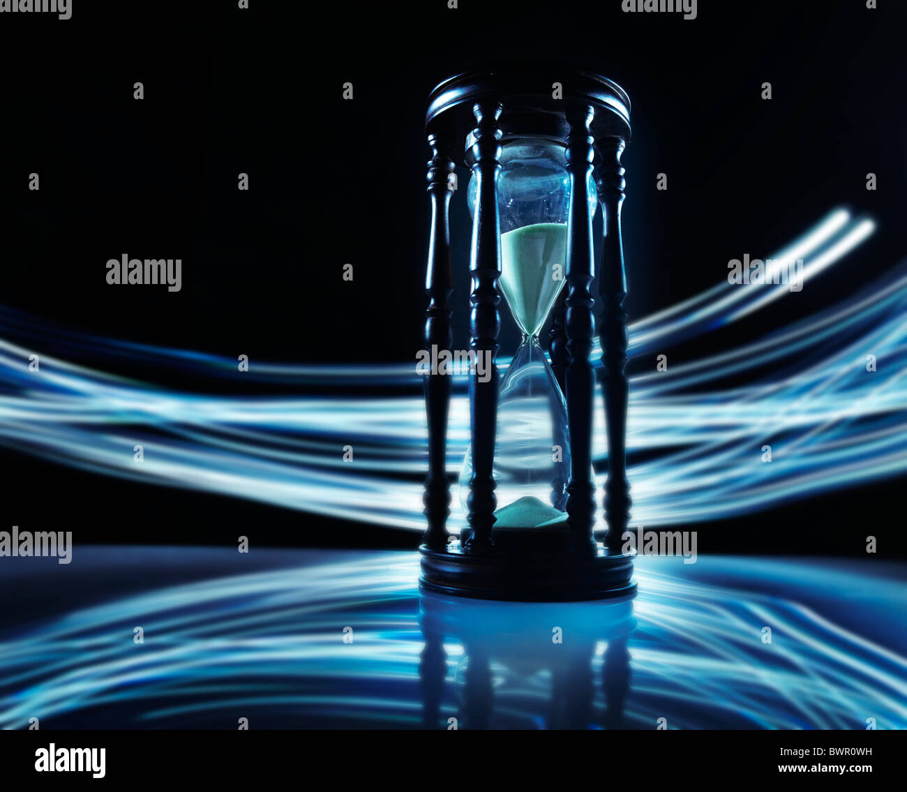 Hourglass with blue streaks rushing by Stock Photo Alamy