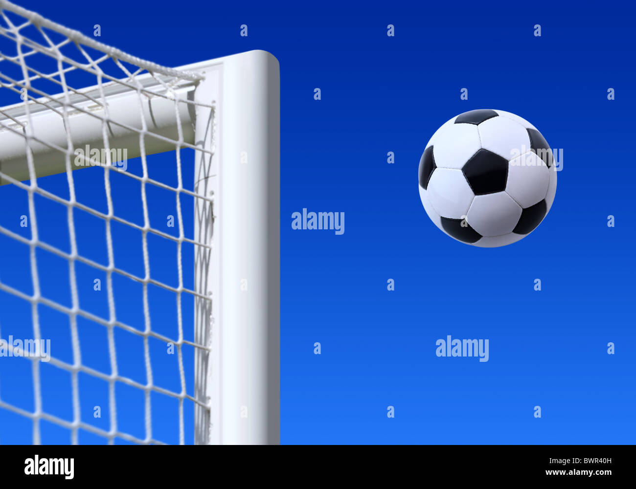 football entering the net scoring a goal Stock Photo