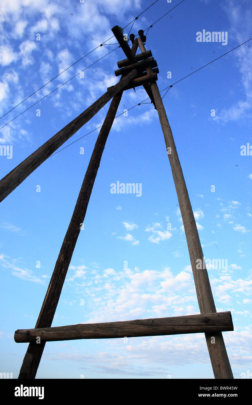 wooden electric pole on a background of blue sky Stock Photo - Alamy