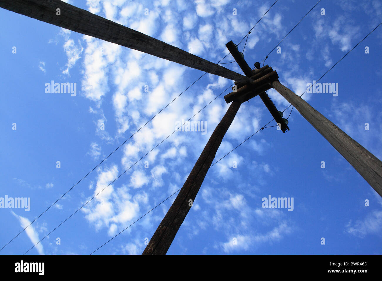 wooden electric pole on a background of blue sky Stock Photo - Alamy