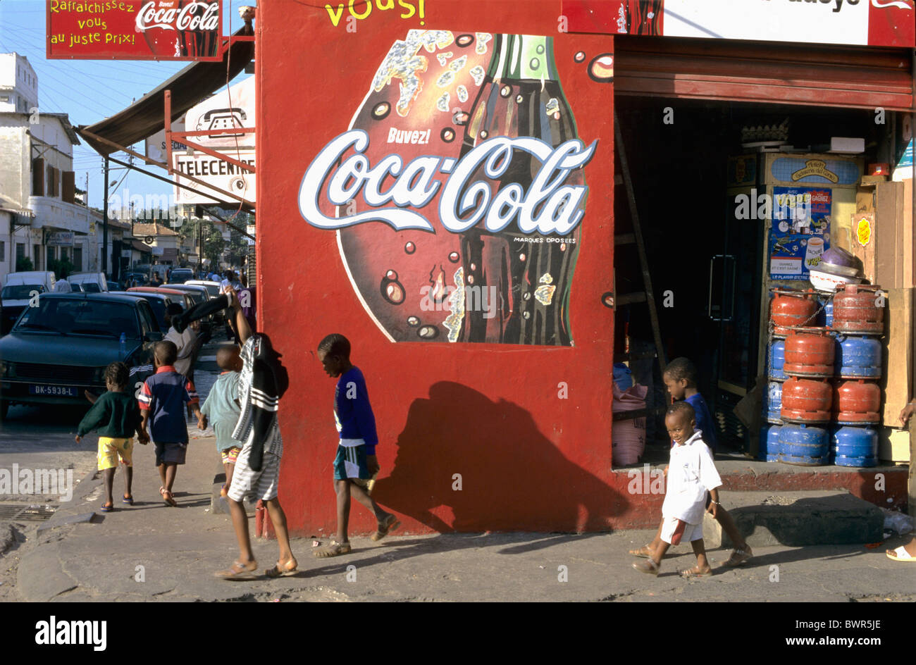 Senegal Dakar city Downtown streetscene African town Dakar red Coca-Cola  store shop local people cars chi Stock Photo - Alamy