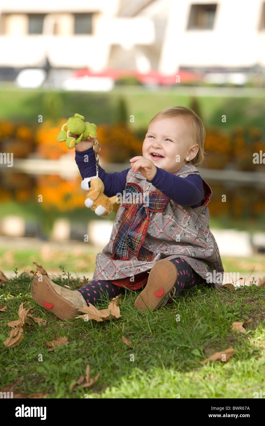 Little girl playing in the park Stock Photo - Alamy