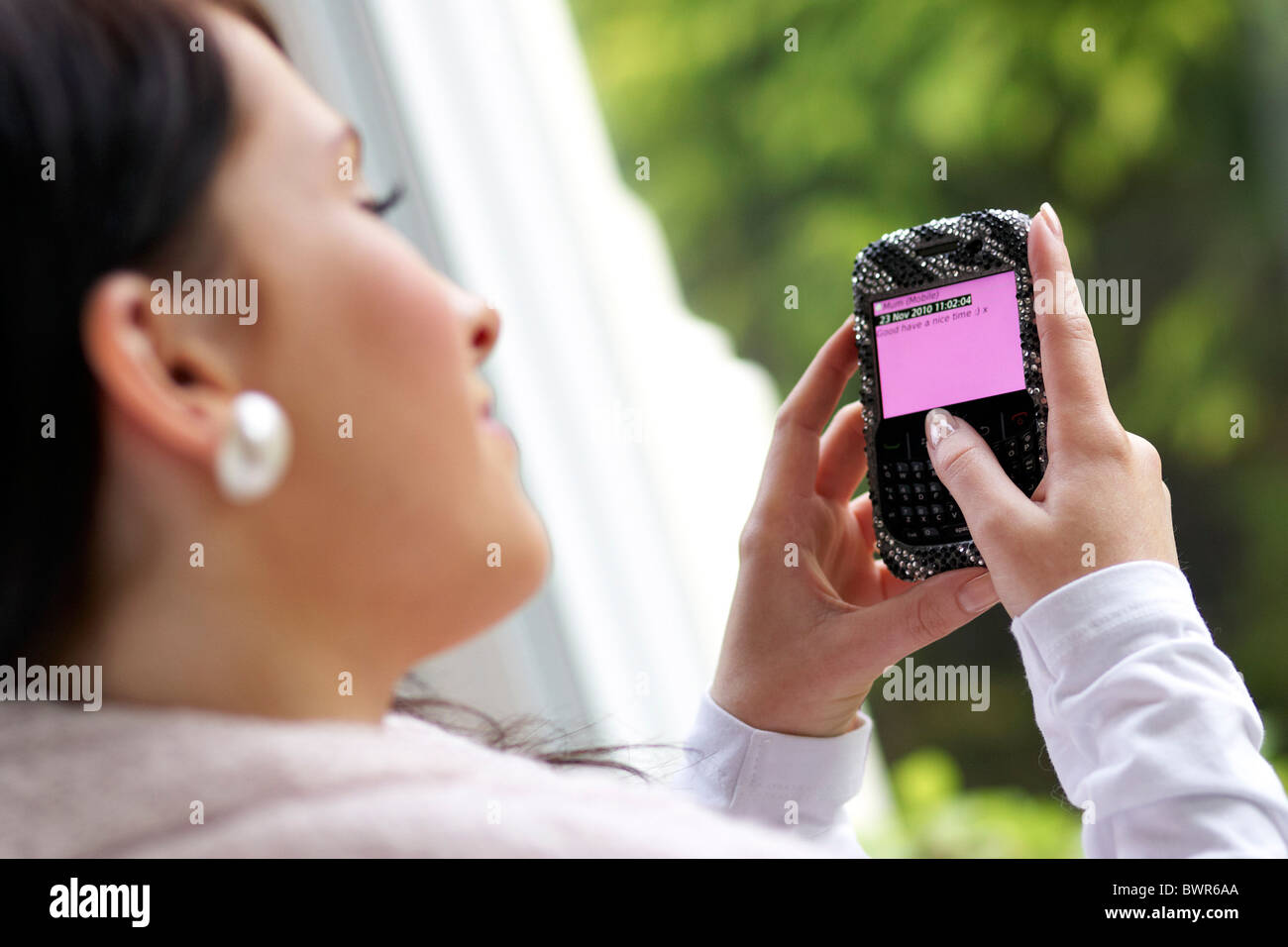 Girl using phone Stock Photo