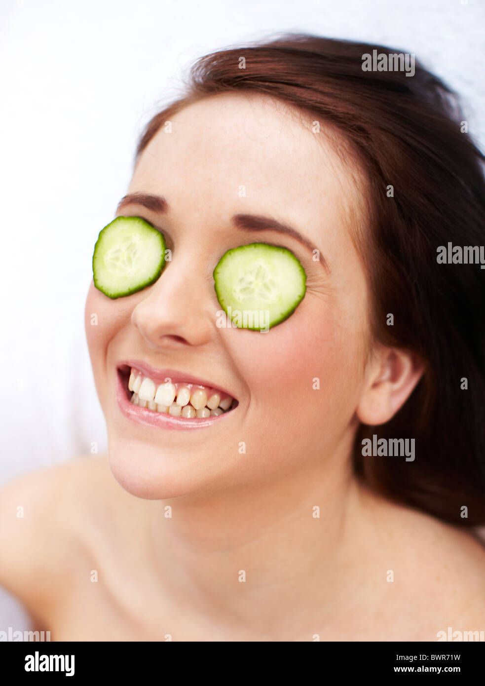 Woman with cucumber over her eyes Stock Photo Alamy
