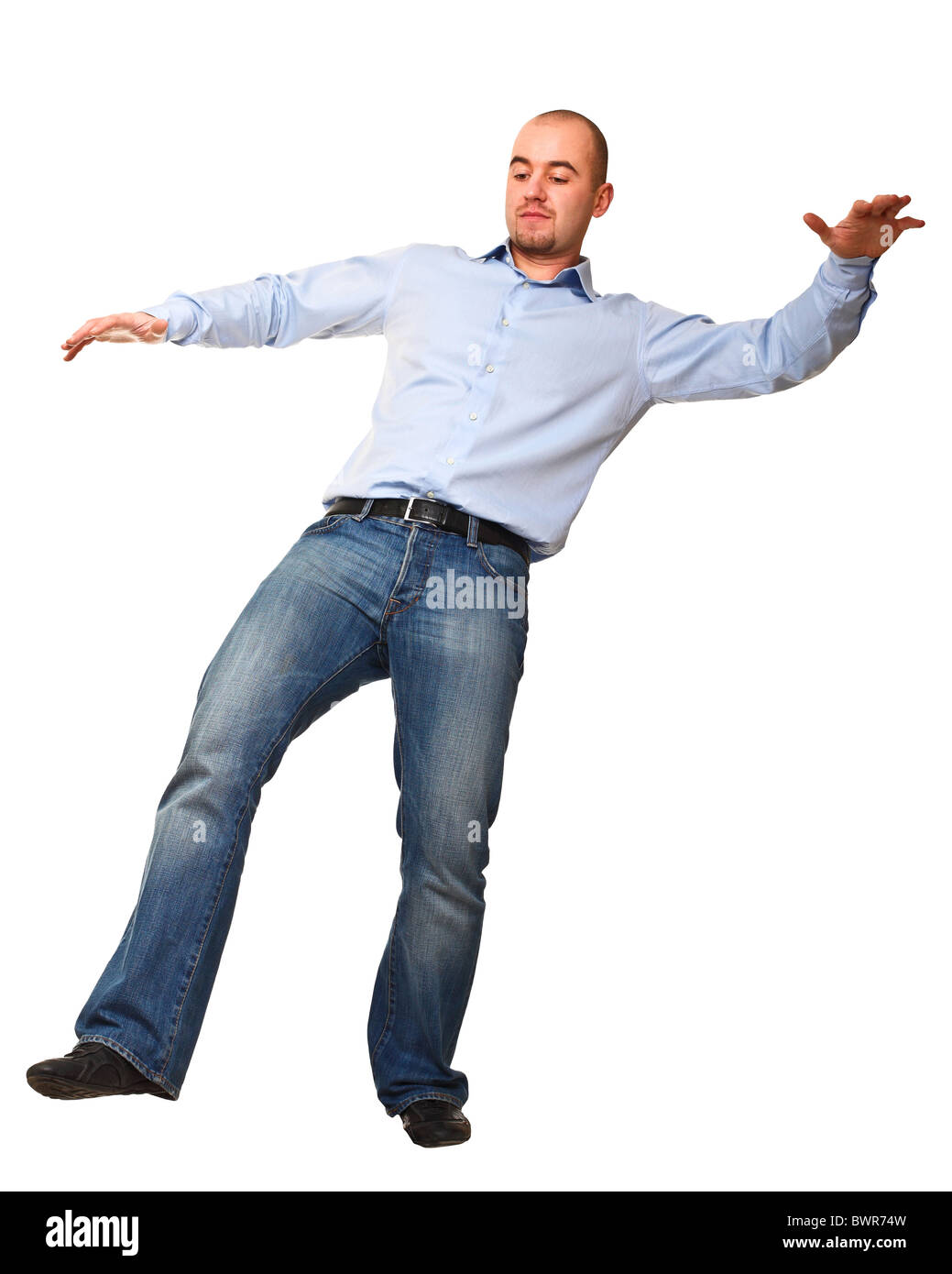 young caucasian man has problem with balance isolated on white Stock Photo