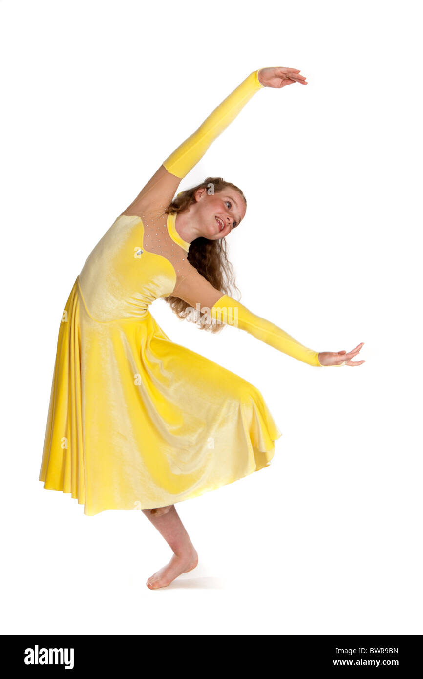 Studio shot of beautiful young girl in yellow lyrical dancing costume Stock Photo Alamy