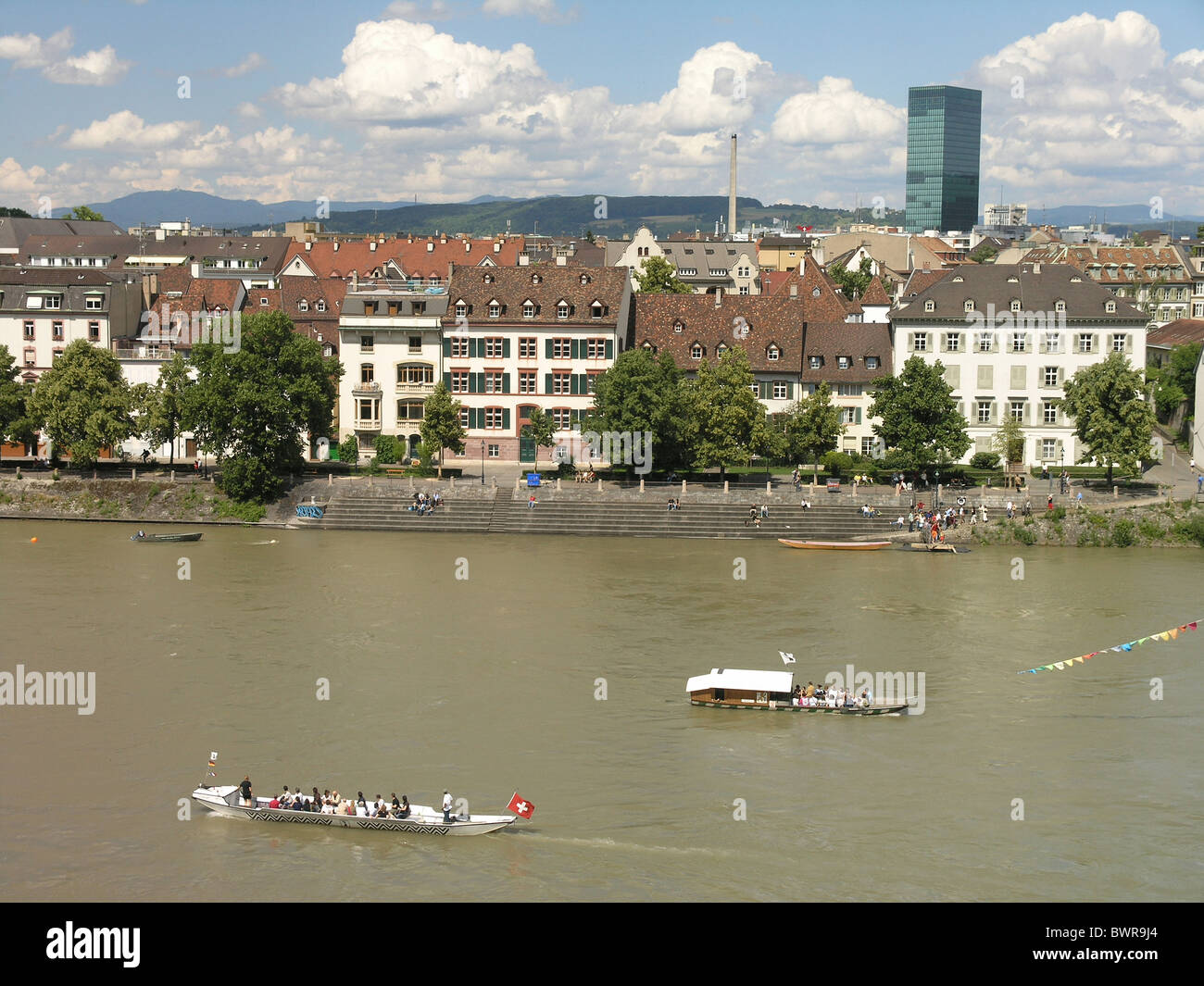 Switzerland Europe Basel City Rhine River Rhine ferry passengers Boat transport Kleinbasel Messe tower Stock Photo