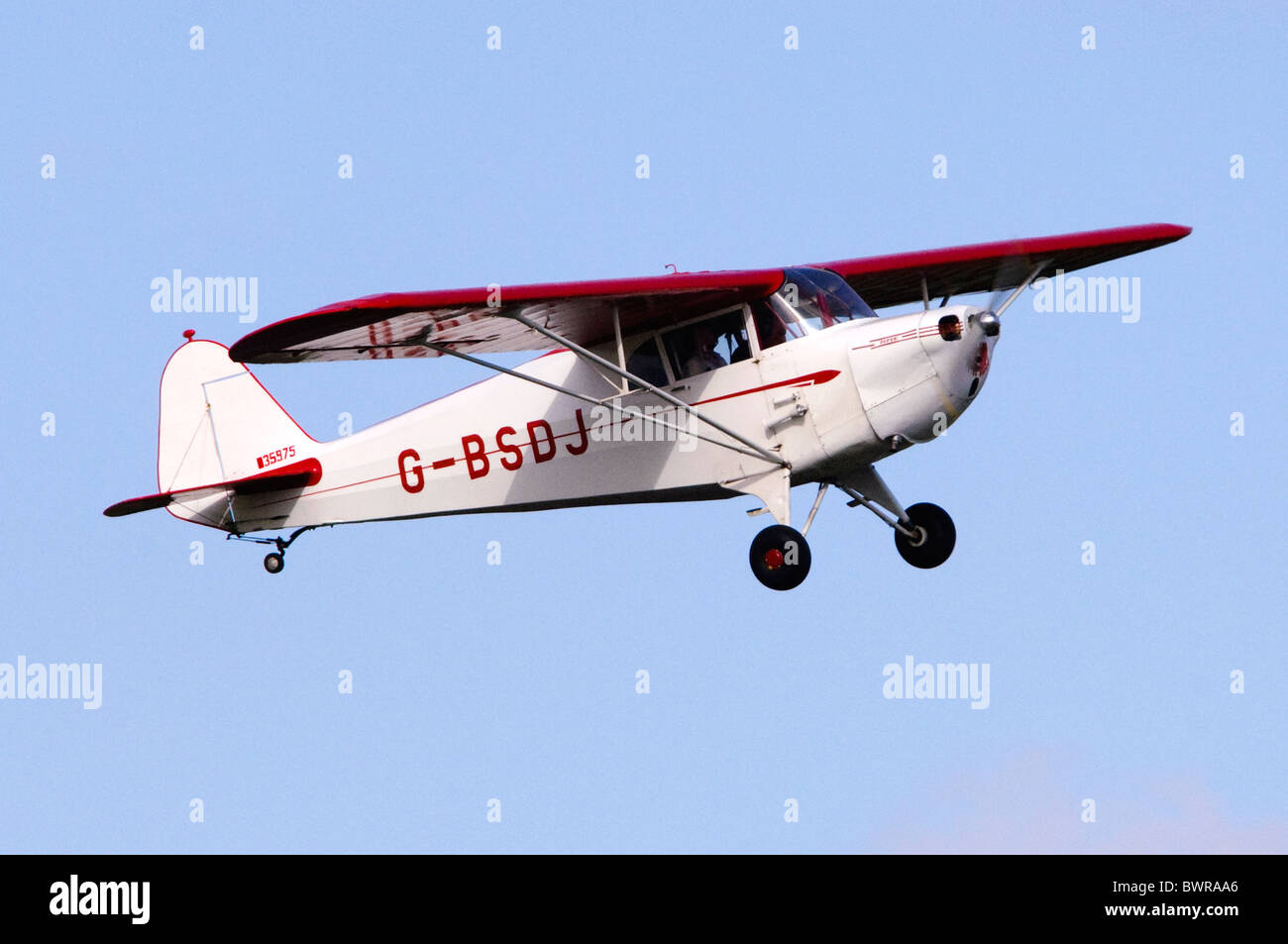Piper Cub Coupe light plane climbing after take off from RAF Benson Stock Photo