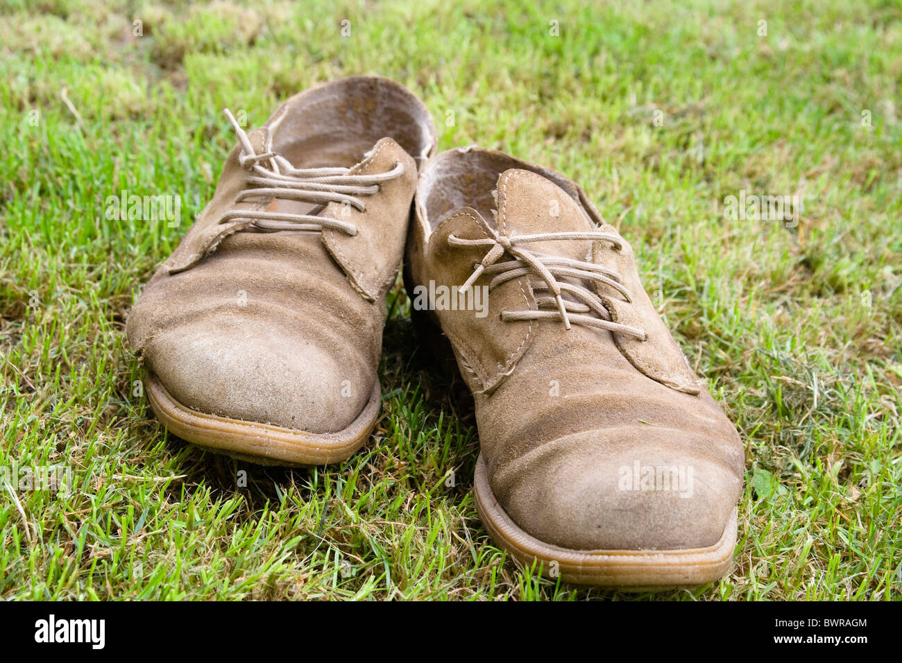 old shoes meadow leather worn worn-out outside outdoors pair detail wearing Stock Photo
