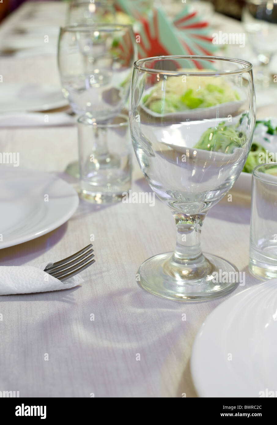 laid table with tableware and dishes for banquet Stock Photo - Alamy