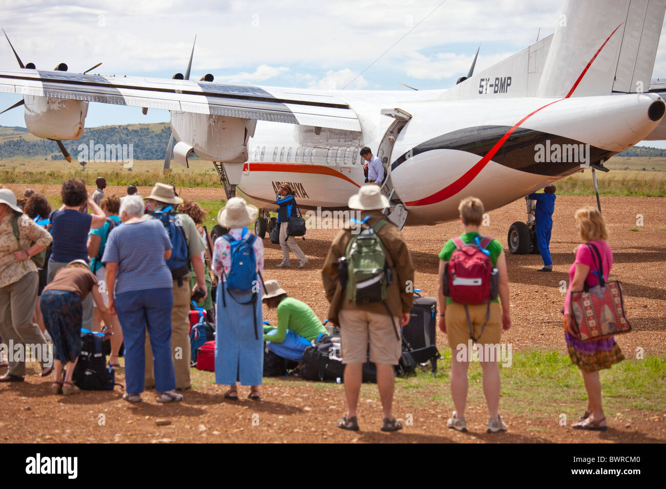 Air Kenya flight arriving in the Masai Mara, bringing tourists for