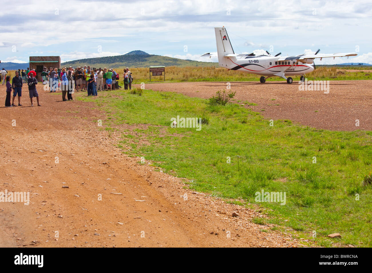 Air Kenya flight arriving in the Masai Mara, bringing tourists for safari, Kenya, East Africa Stock Photo