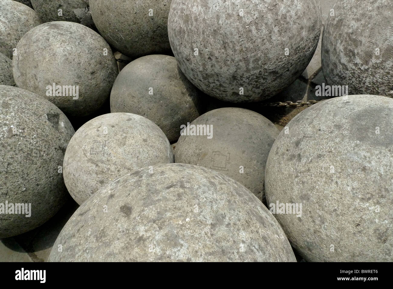 balls of stone, in differing sizes and weights. Stock Photo