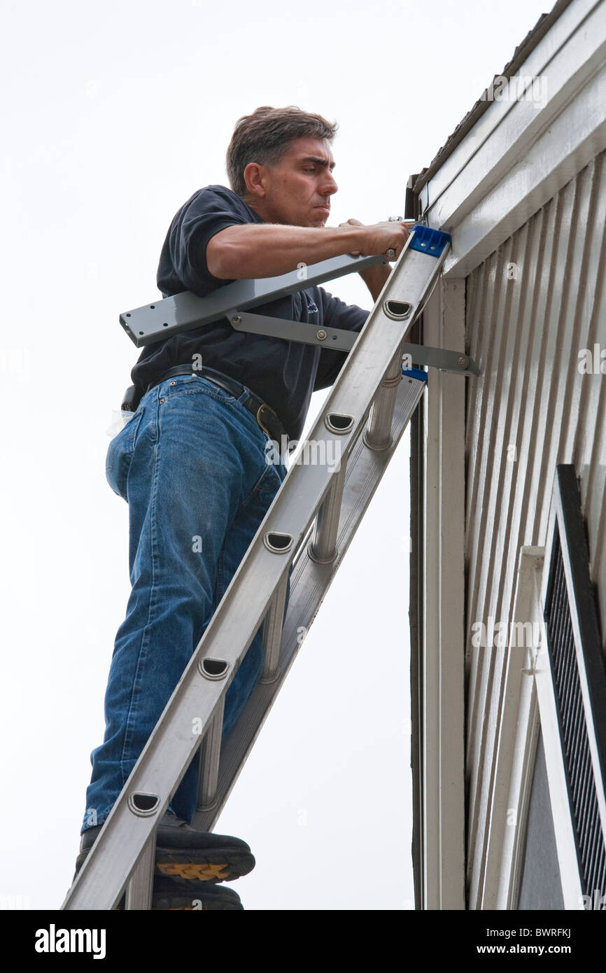 Picture of Installation of a residential wind turbine is filmed for an episode of ...