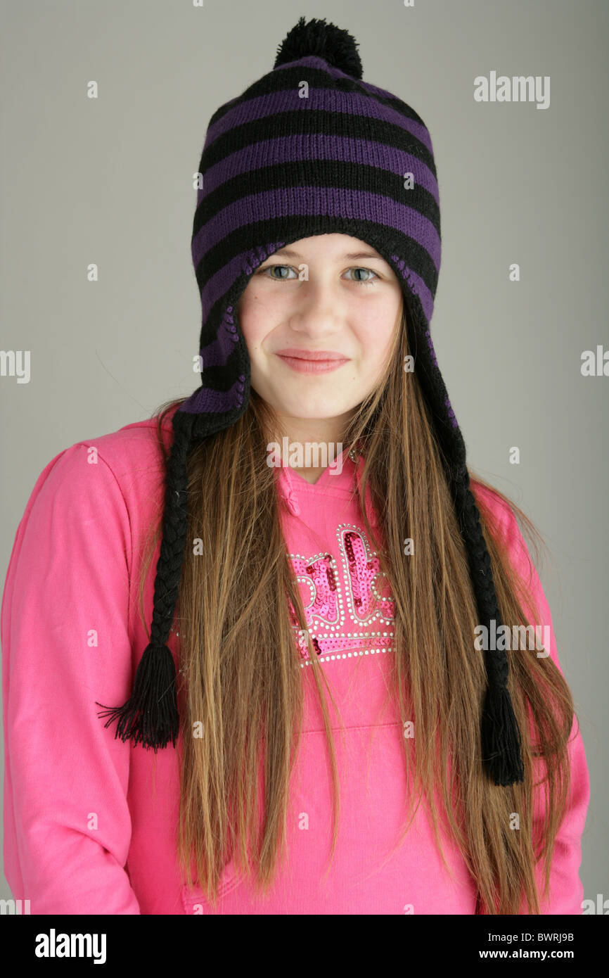 Portrait of a ten year old girl wearing a woolly hat Stock Photo Alamy